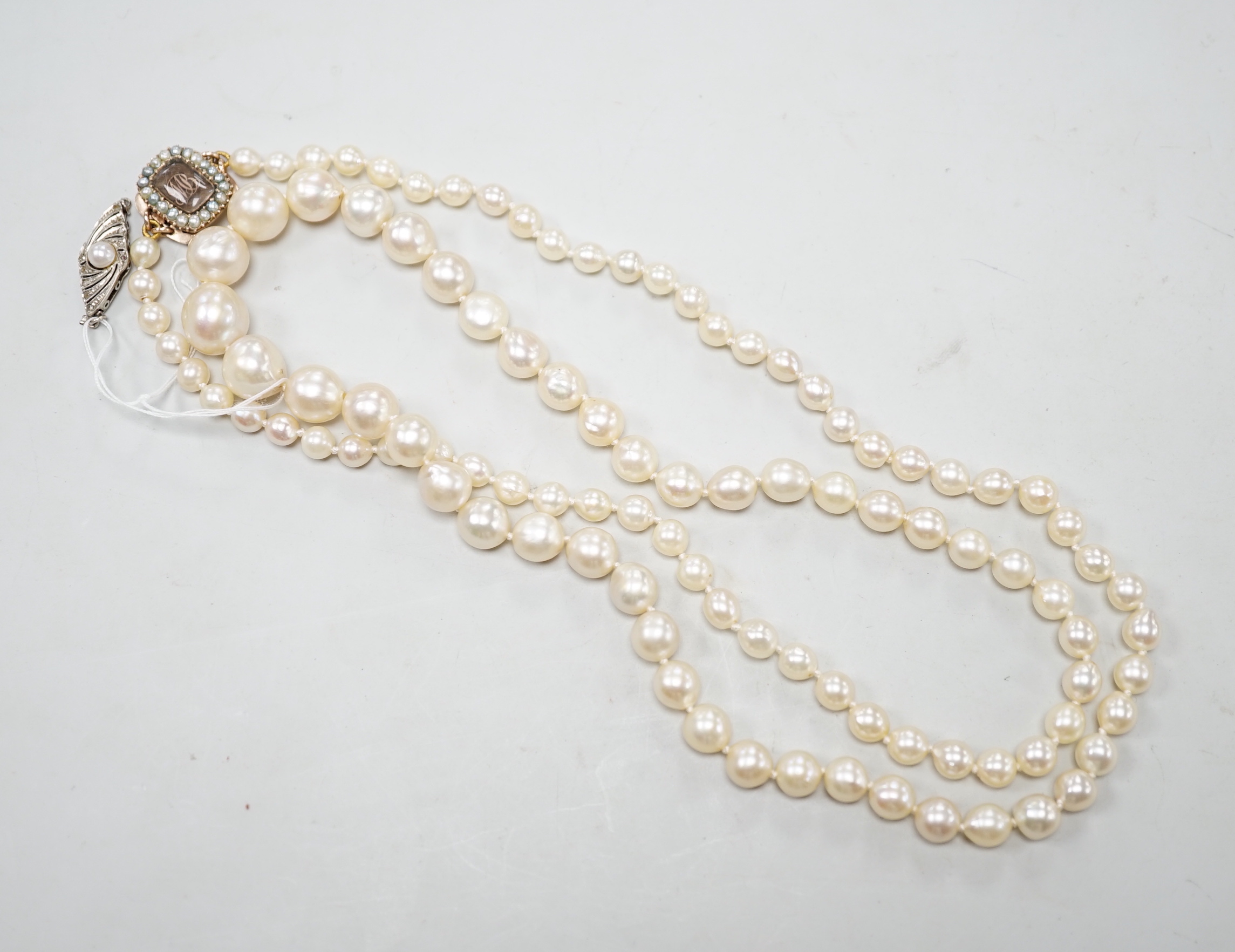 A single strand graduated cultured pearl necklace, now with an earlier 19th century seed pearl and plaited hair set clasp, 76cm, together with original clasp.